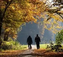 couple walking through the woods